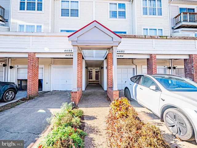 a front view of a house with parking