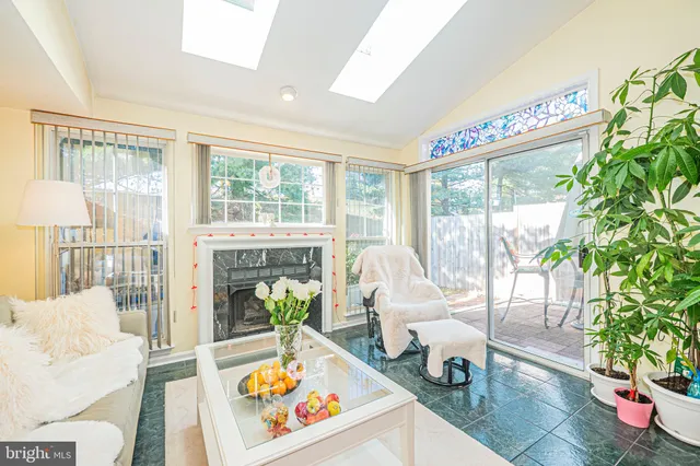 a bathroom with a sink a toilet a mirror a vanity and shower