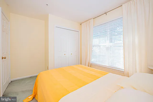 a bedroom with a bed and a table