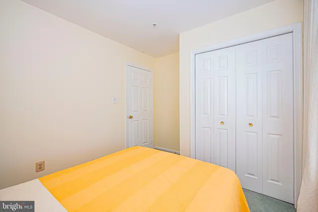 a bed room with a bed and a chandelier