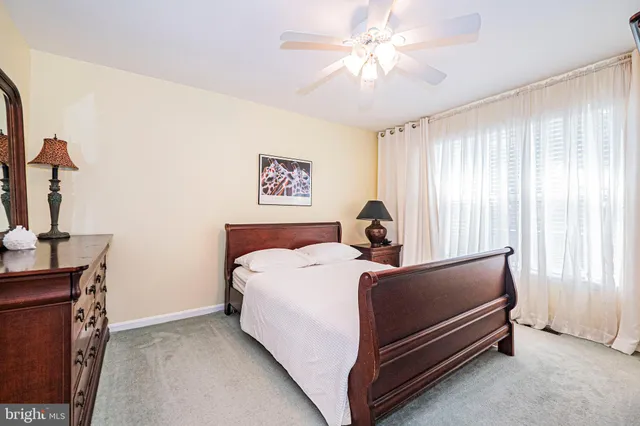 a bed room with two bed and a chandelier