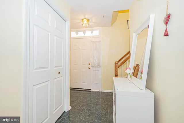 a living room with furniture toys and a large window