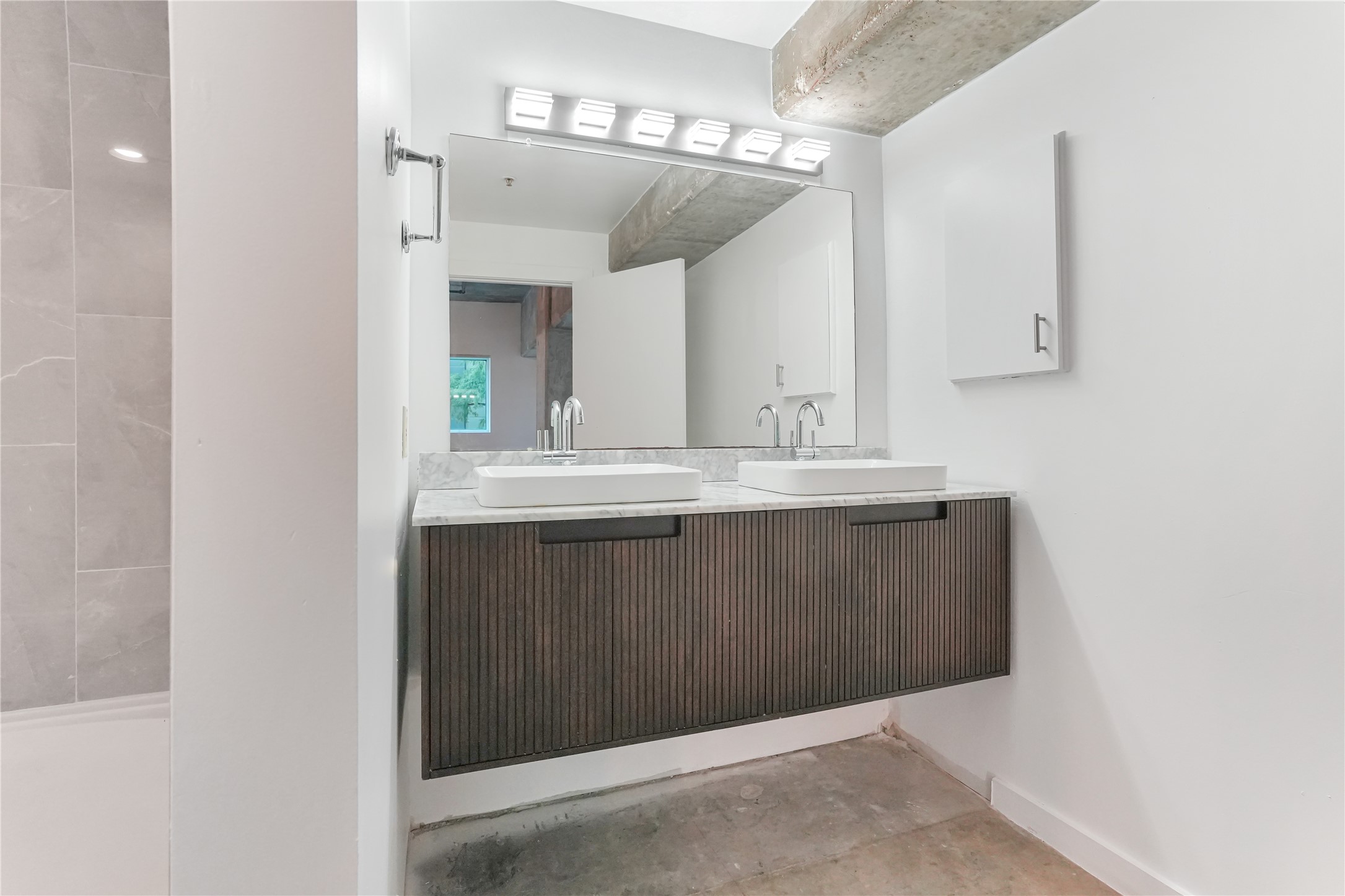 2000 Bagby Street, Unit 2401 Houston, TX 77002 - Photo 12 of 39 a bathroom with a sink vanity and mirror