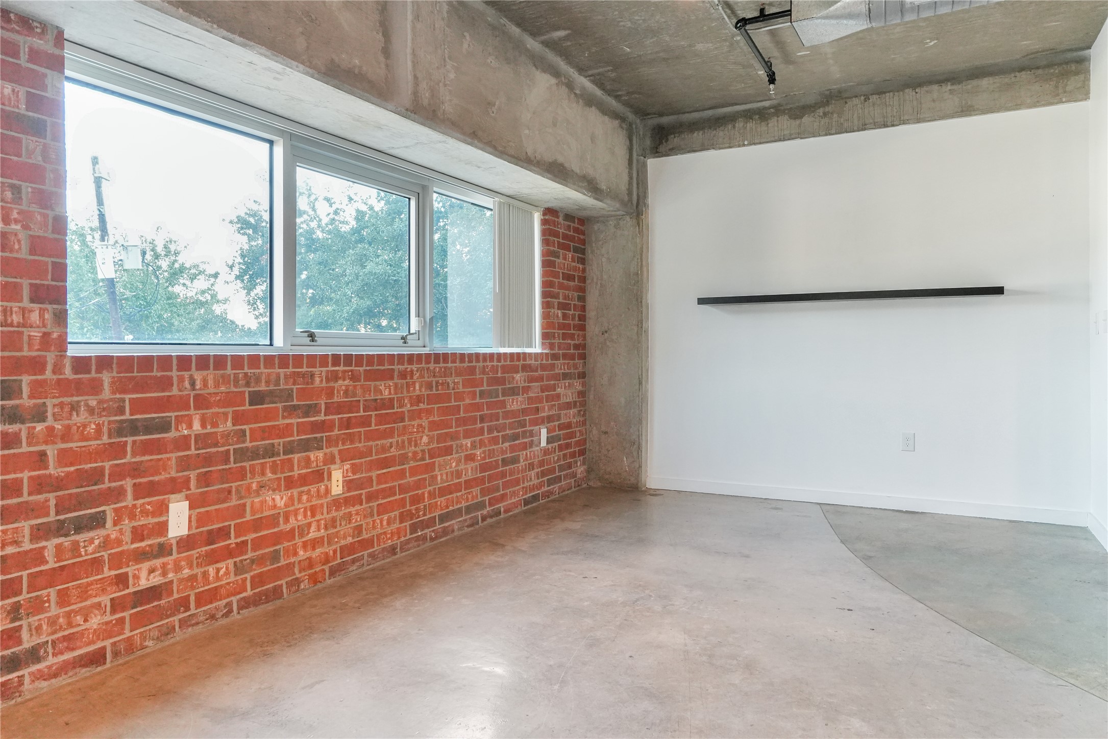 2000 Bagby Street, Unit 2401 Houston, TX 77002 - Photo 32 of 39 a view of an empty room with a window