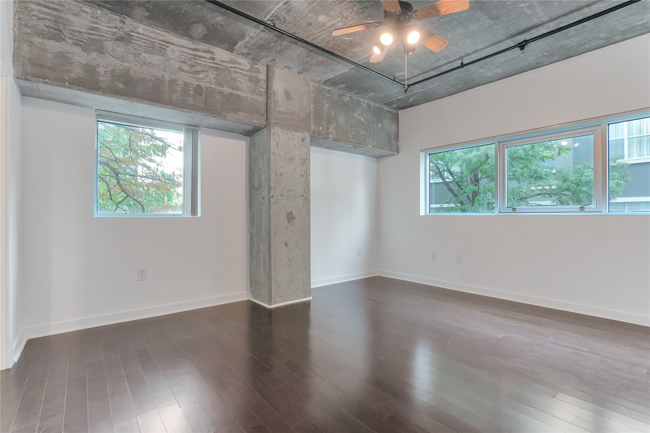 2000 Bagby Street, Unit 2401 Houston, TX 77002 - Photo 9 of 39 an empty room with wooden floor and windows