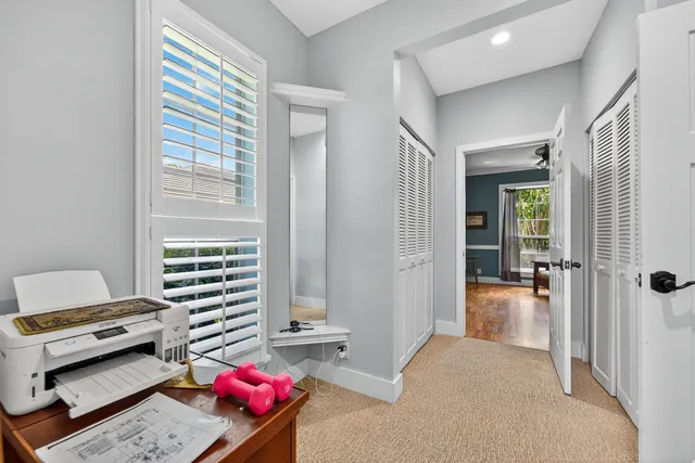 a bedroom with furniture and a window