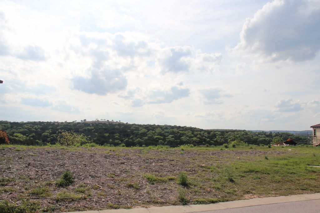 405 Rough Hollow Cove Austin, TX 78734 - Photo 1 of 1 a view of a field with trees