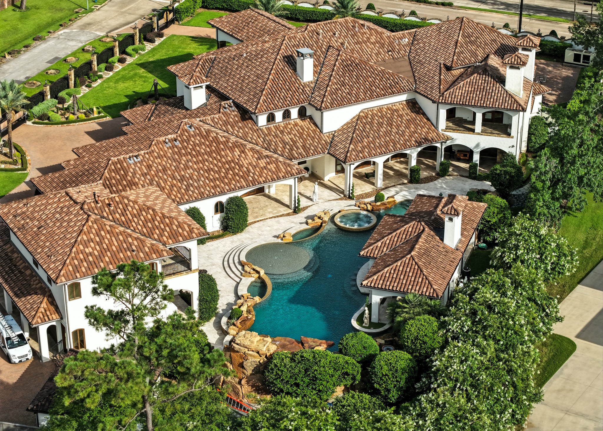 an aerial view of a house with garden space and street view