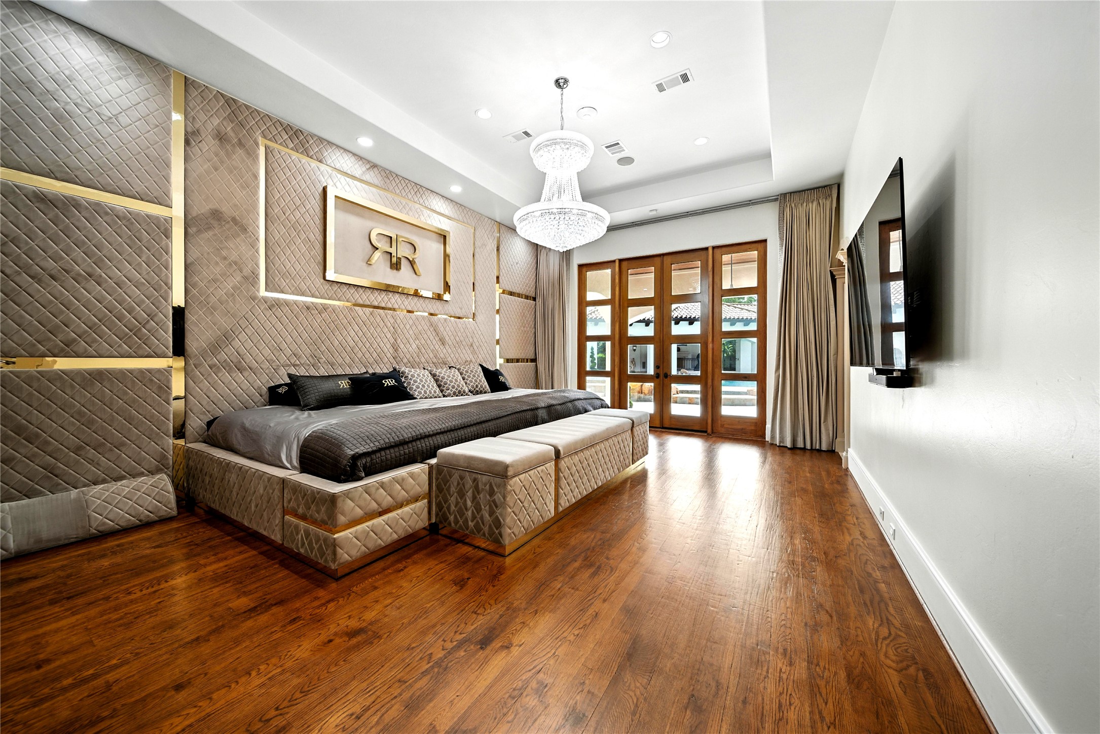 701 West Friar Tuck Lane Houston, TX 77024 - Photo 11 of 43 a living room with furniture a chandelier and wooden floor