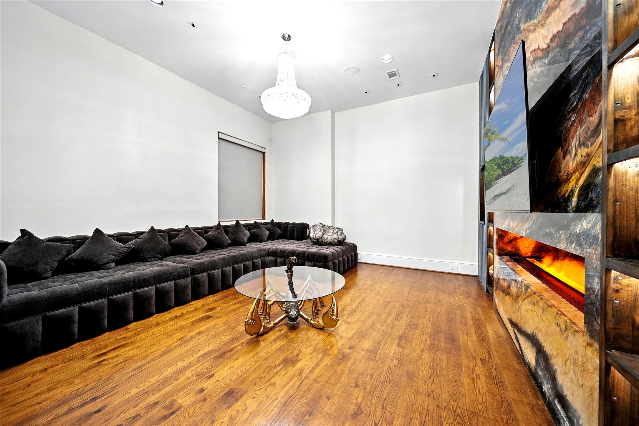 701 West Friar Tuck Lane Houston, TX 77024 - Photo 13 of 43 a living room with furniture and a wooden floor