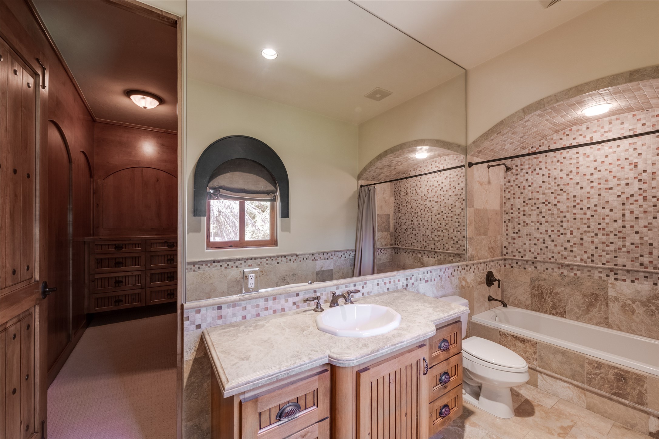 701 West Friar Tuck Lane Houston, TX 77024 - Photo 26 of 43 a bathroom with a sink and a mirror