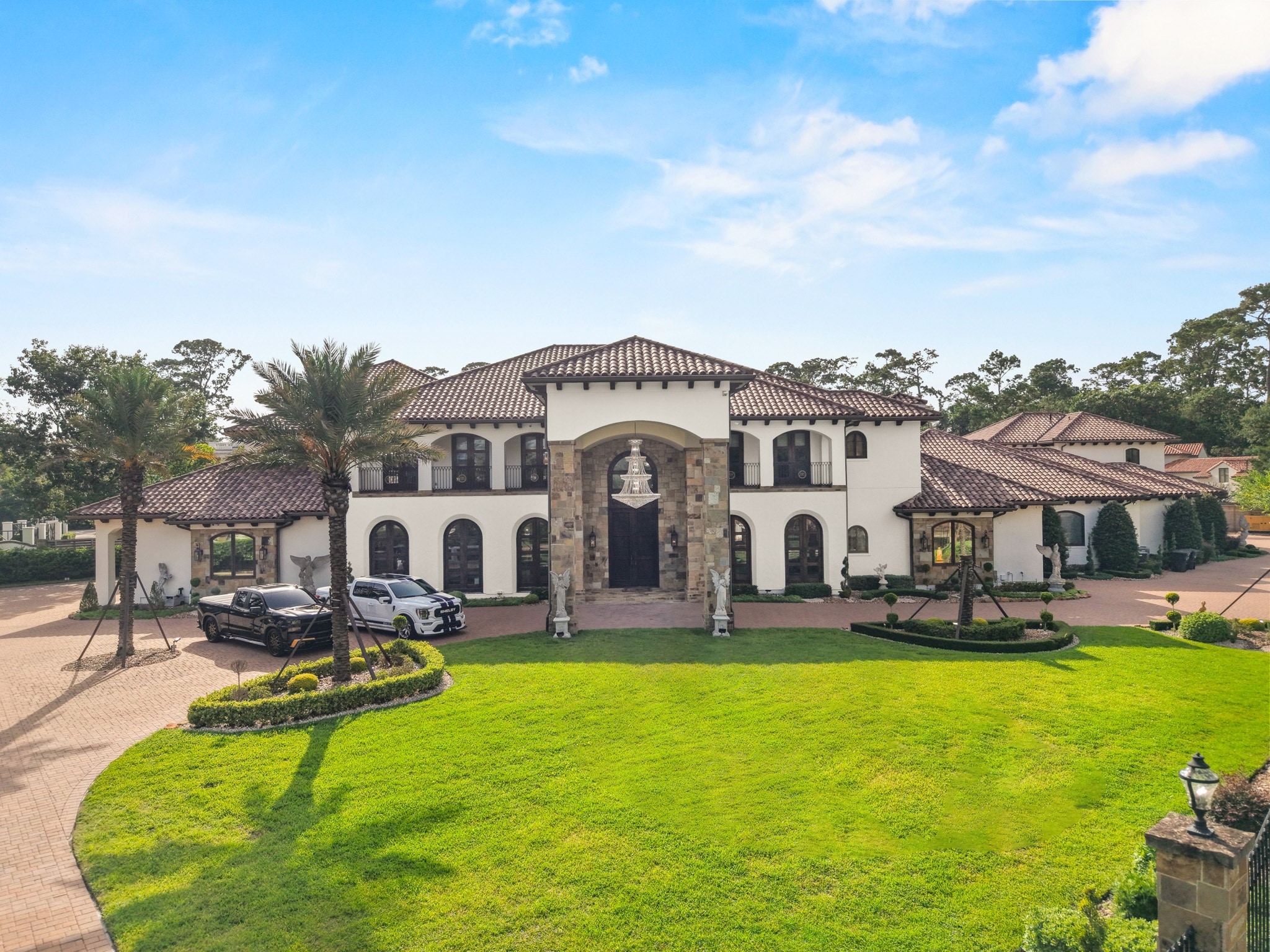 701 West Friar Tuck Lane Houston, TX 77024 - Photo 3 of 43 a front view of building with swimming pool and outdoor seating