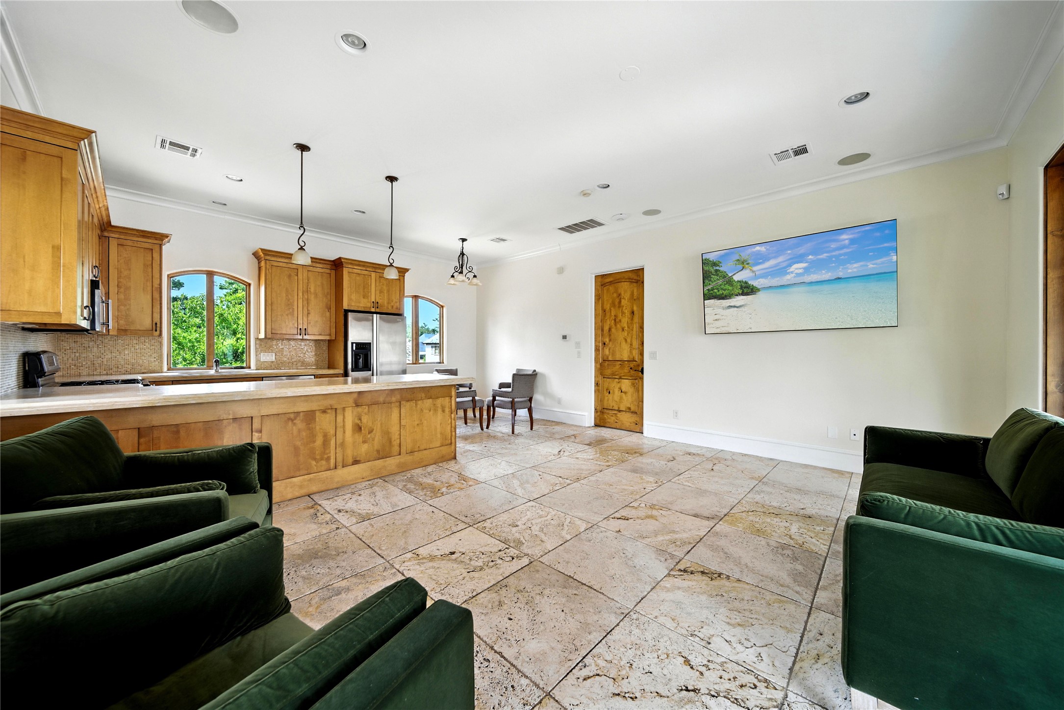 701 West Friar Tuck Lane Houston, TX 77024 - Photo 40 of 43 a large living room with stainless steel appliances kitchen island granite countertop furniture and a view of kitchen