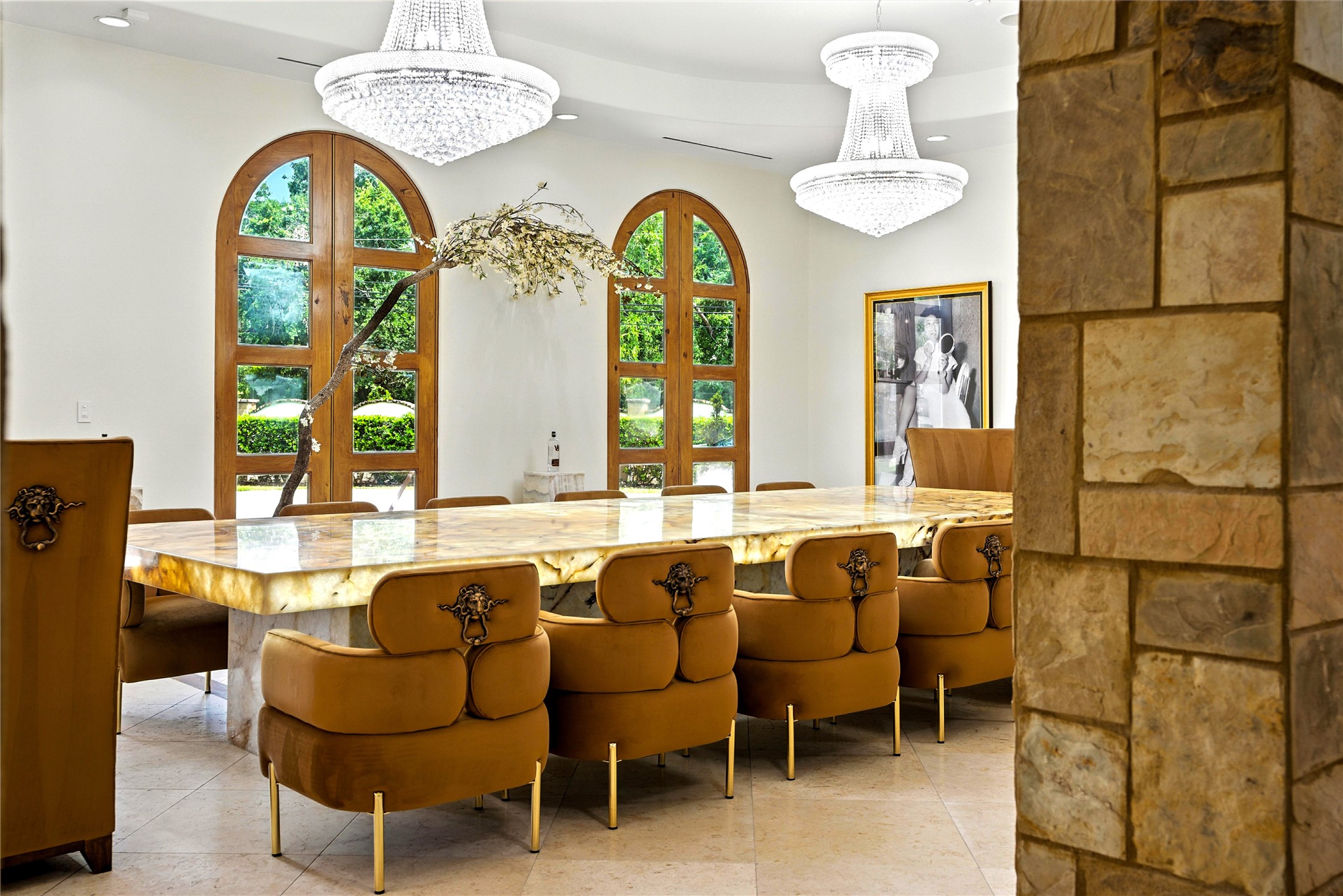 701 West Friar Tuck Lane Houston, TX 77024 - Photo 4 of 43 a large living room with couches a table and a chandelier