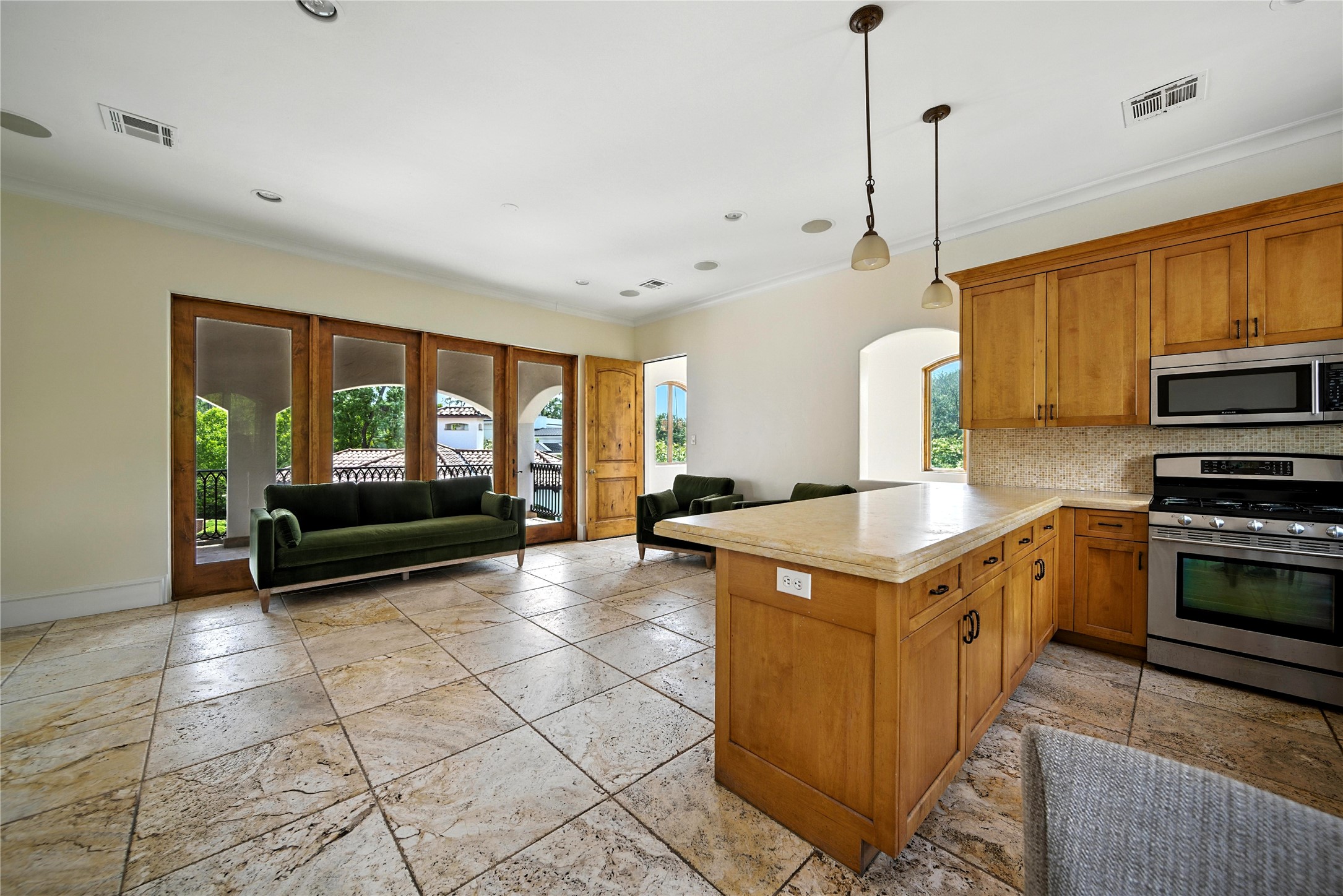 701 West Friar Tuck Lane Houston, TX 77024 - Photo 41 of 43 a kitchen with stainless steel appliances granite countertop a stove a sink and a microwave