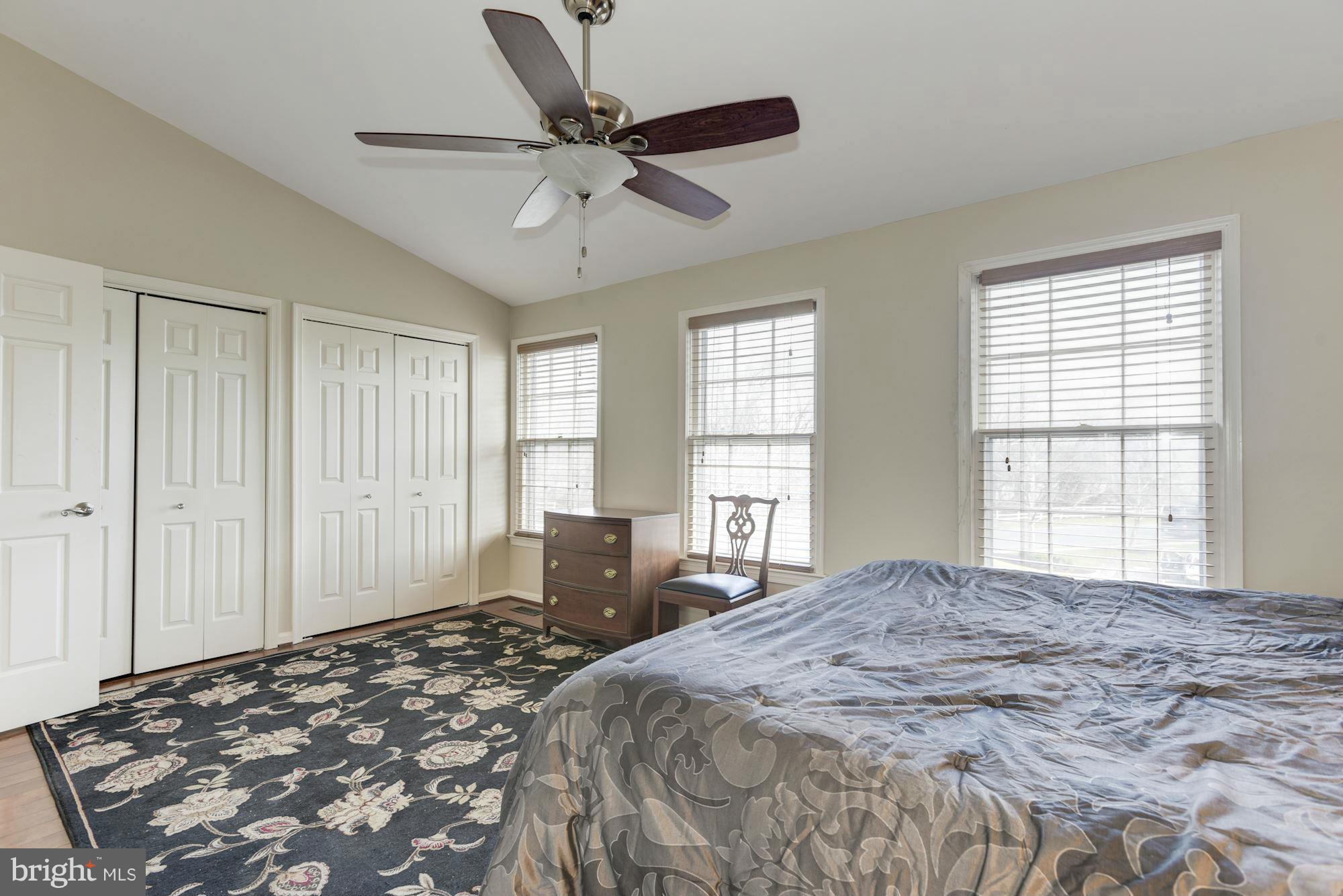 419 Davis Avenue Southwest Leesburg, VA 20175 - Photo 11 of 19 a spacious bedroom with a large bed and a window