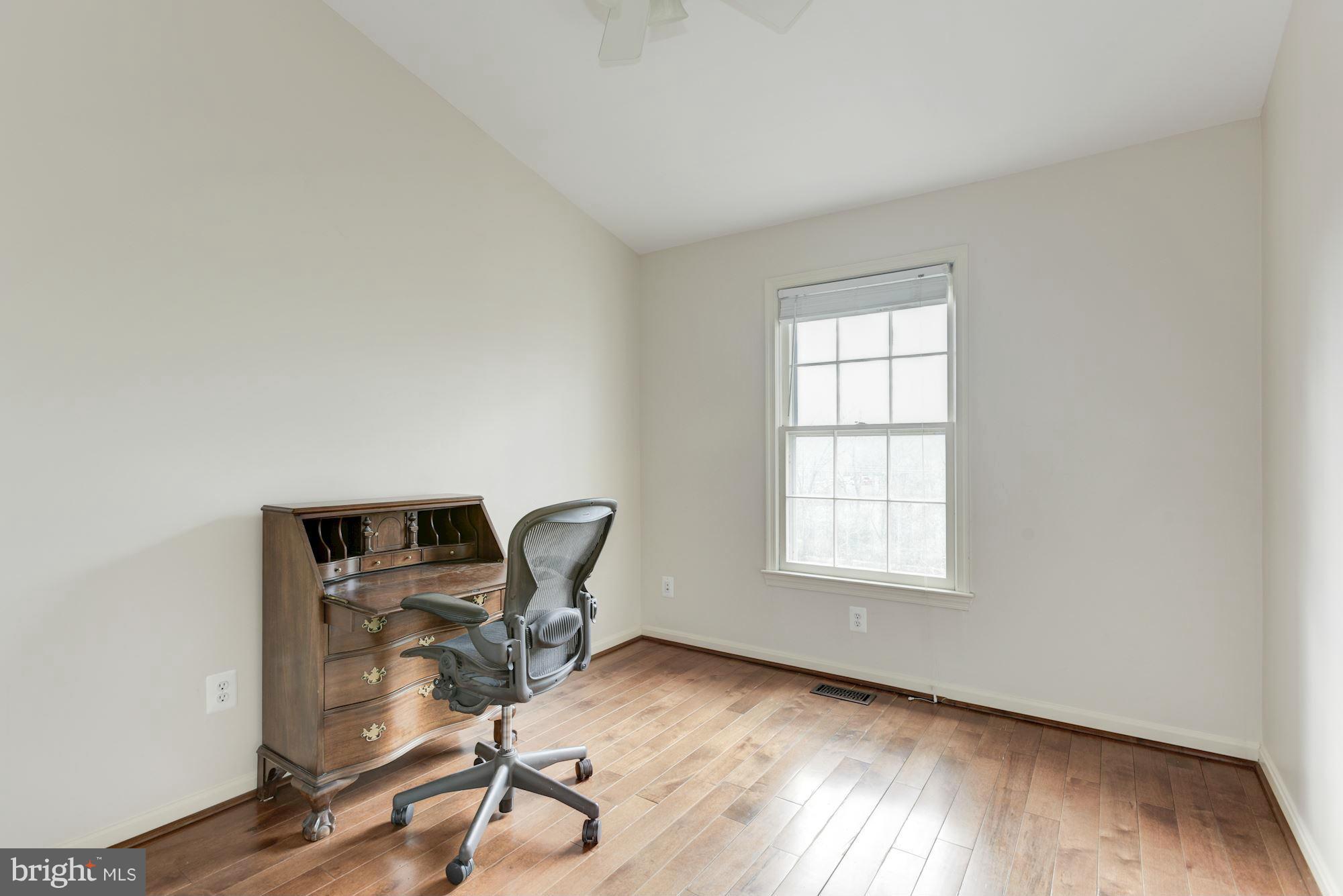 419 Davis Avenue Southwest Leesburg, VA 20175 - Photo 12 of 19 a view of a workspace with furniture and a window