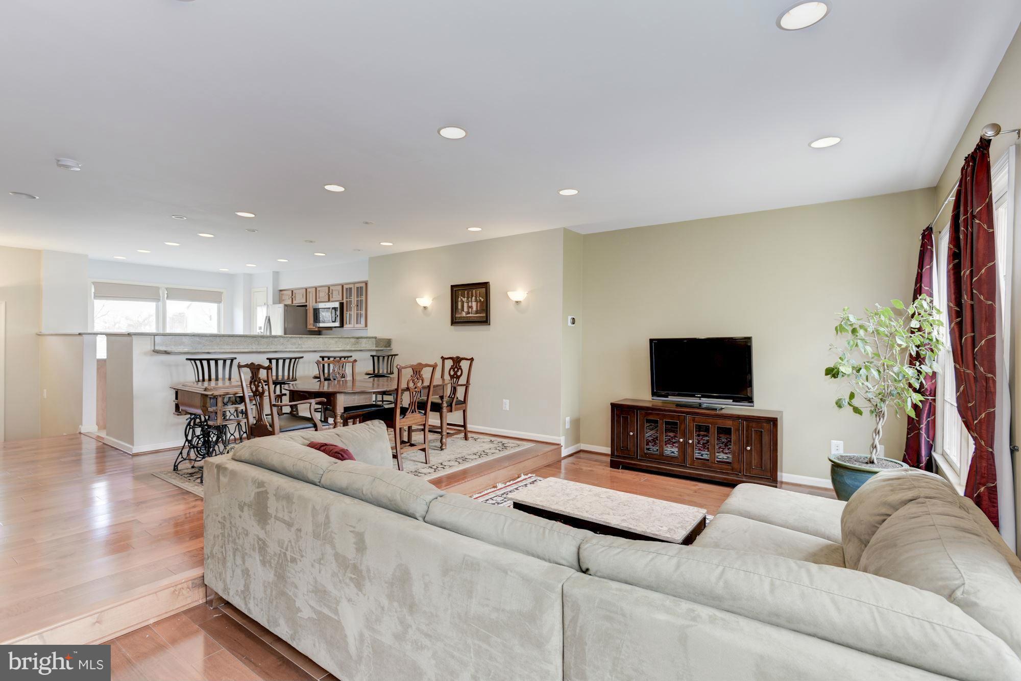 419 Davis Avenue Southwest Leesburg, VA 20175 - Photo 3 of 19 a living room with furniture and a flat screen tv