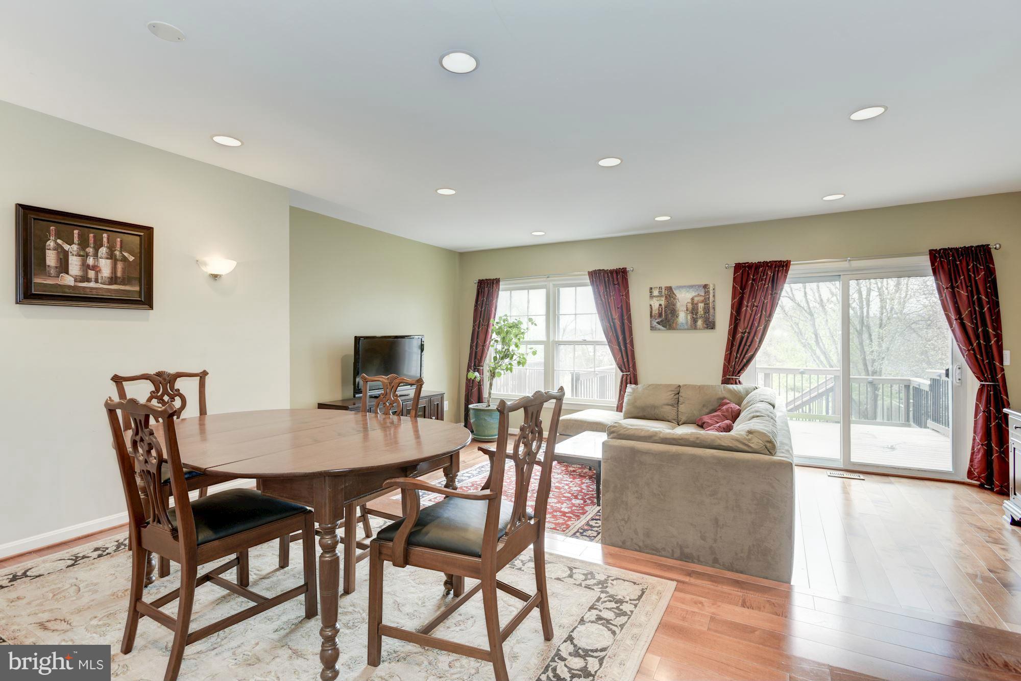 419 Davis Avenue Southwest Leesburg, VA 20175 - Photo 4 of 19 a view of a dining room with furniture window and wooden floor