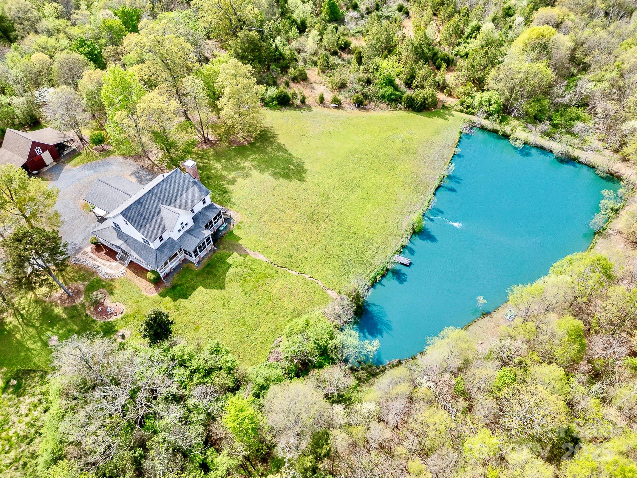 1151 Trull Hinson Road Wingate, NC 28174 - Photo 15 of 17 a view of a lake with a building in the background