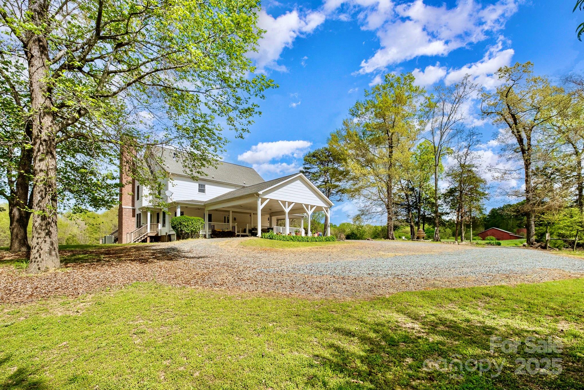 1151 Trull Hinson Road Wingate, NC 28174 - Photo 16 of 17 a front view of a house with a yard and garage