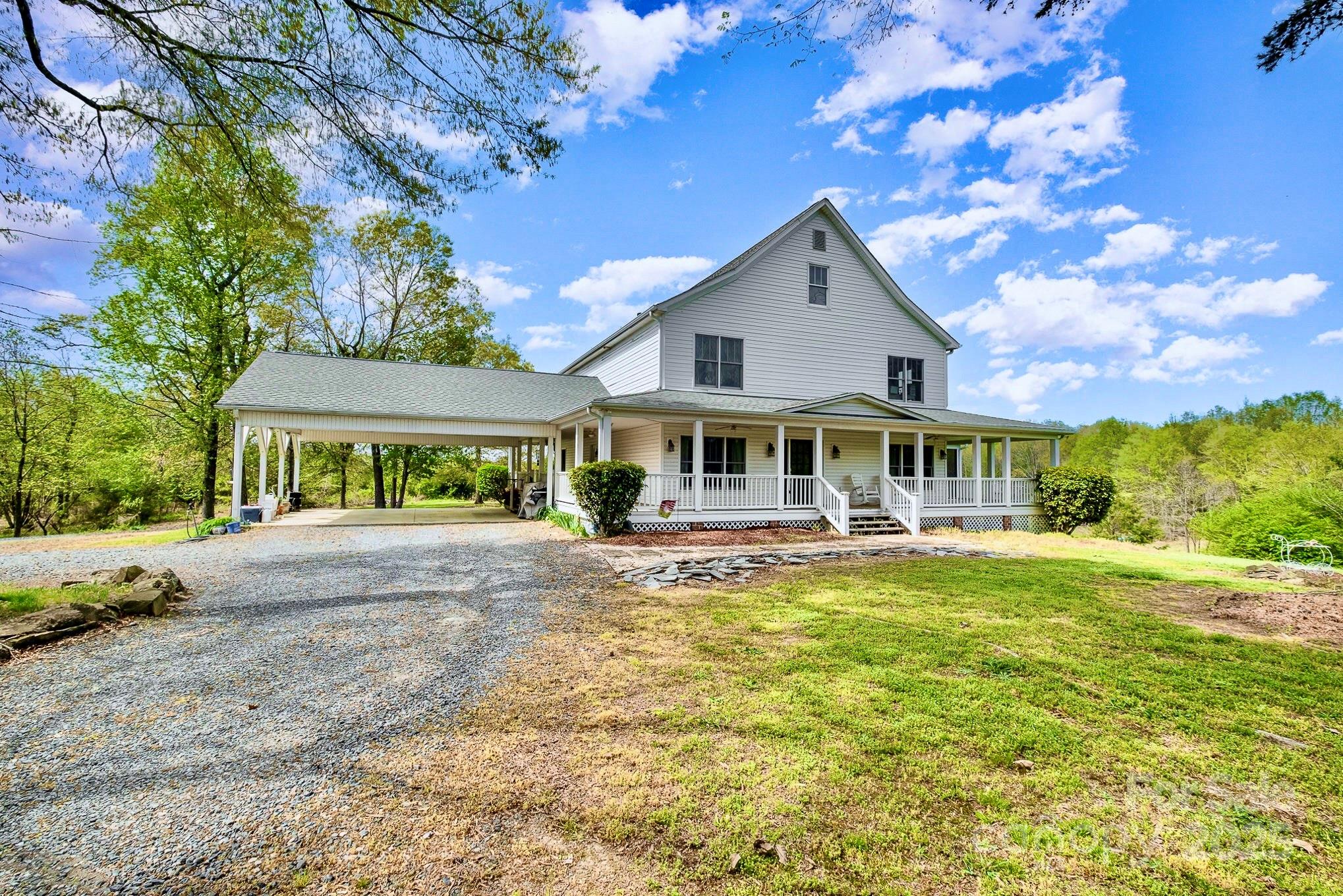 1151 Trull Hinson Road Wingate, NC 28174 - Photo 3 of 17 a front view of a house with garden