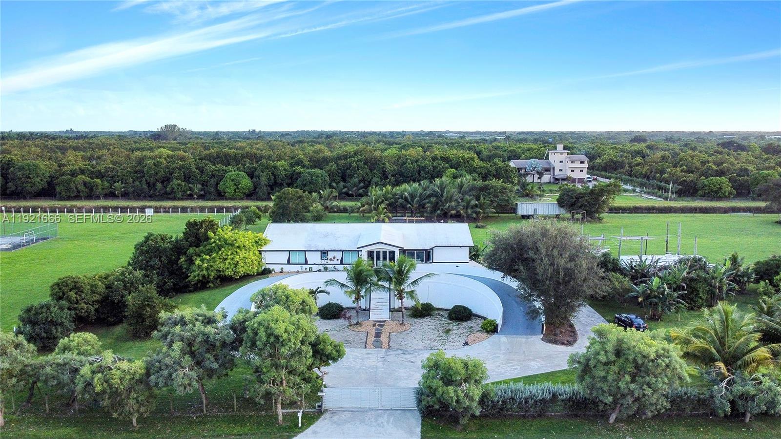 19870 Southwest 190th Street Miami, FL 33187 - Photo 1 of 31 an aerial view of a house with outdoor space