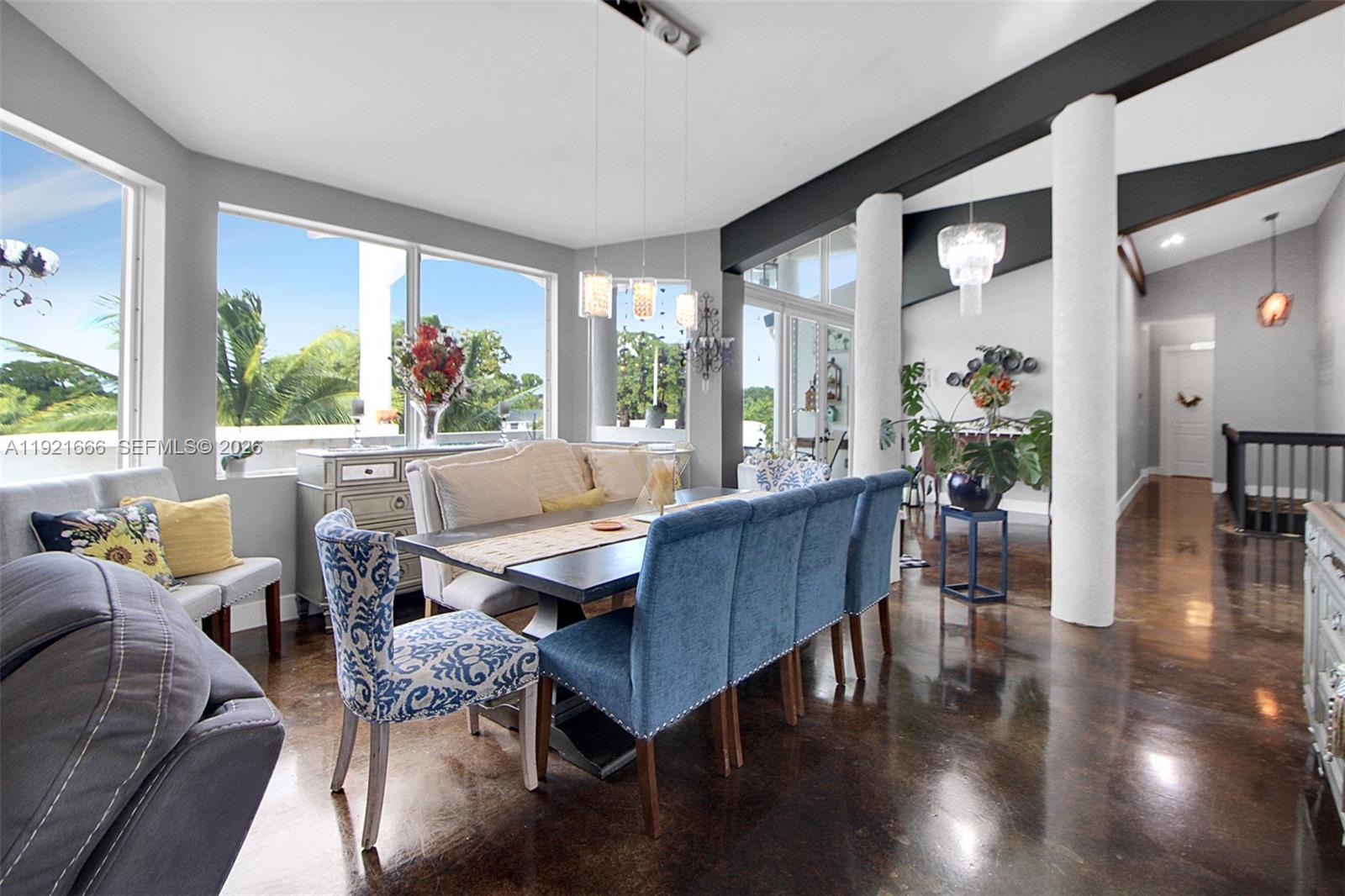 19870 Southwest 190th Street Miami, FL 33187 - Photo 14 of 31 a view of a dining room with furniture large windows and wooden floor