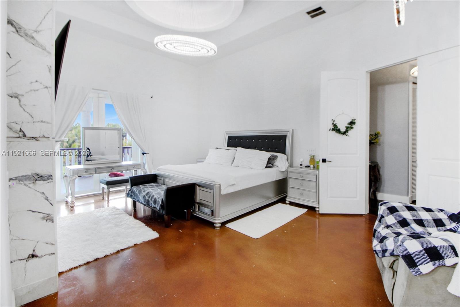 19870 Southwest 190th Street Miami, FL 33187 - Photo 19 of 31 a living room with furniture and a table