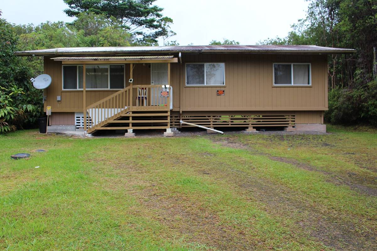 18-1248 Thorne Parkway Mountain View, HI 96771 - Photo 1 of 14 a front view of a house with garden