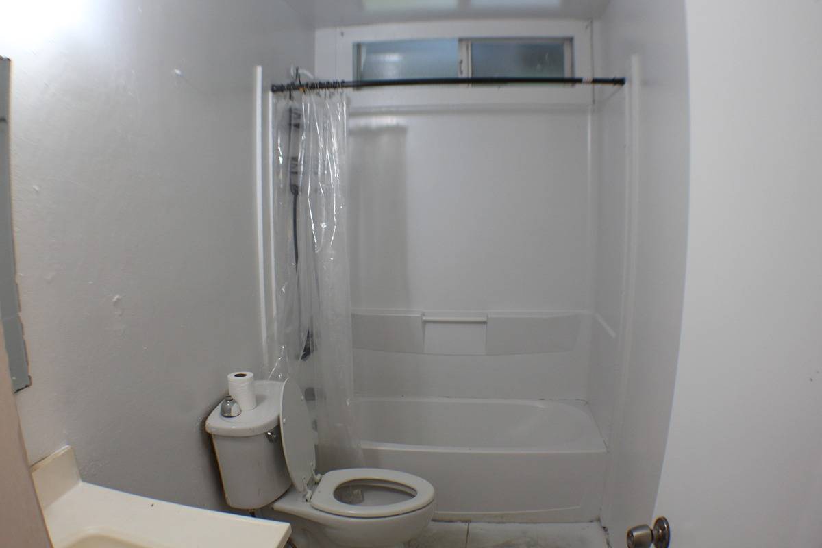 18-1248 Thorne Parkway Mountain View, HI 96771 - Photo 12 of 14 a bathroom with a shower and a toilet