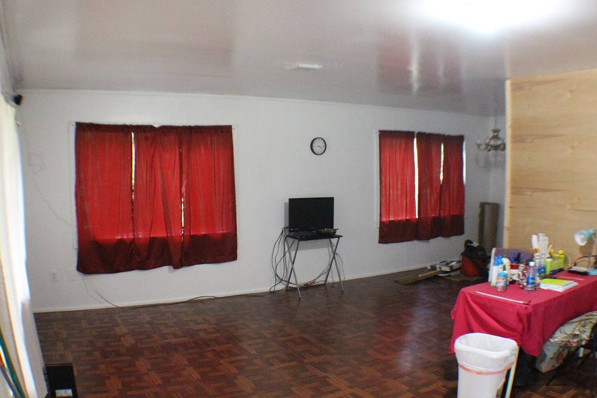 18-1248 Thorne Parkway Mountain View, HI 96771 - Photo 2 of 14 a living room with furniture a rug and a fireplace