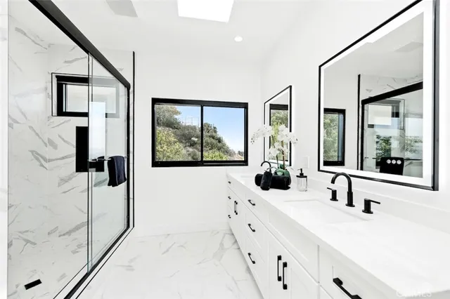 a view of empty room with window and air conditioner