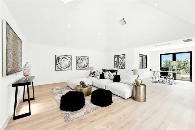 a work room with furniture and wooden floor