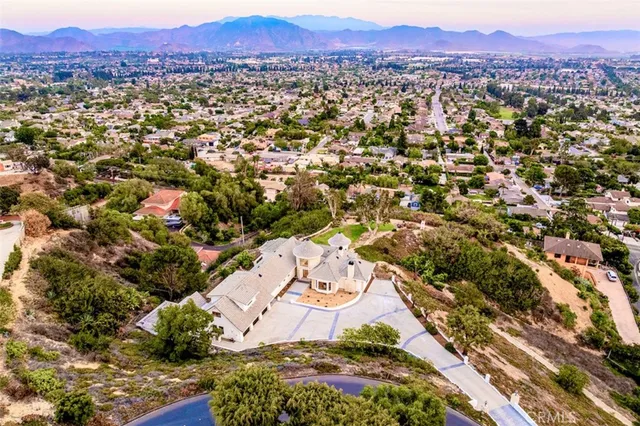 an aerial view of residential building with green space