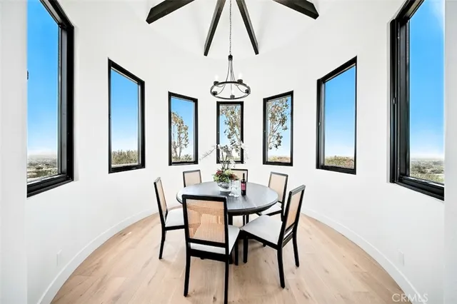 a spacious bedroom with a bed and glass window
