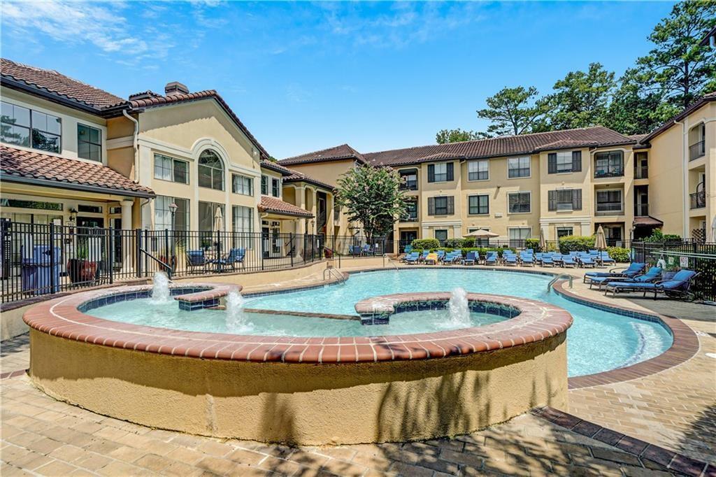 3777 Peachtree Road Northeast, Unit 1212 Atlanta, GA 30319 - Photo 25 of 25 a front view of a house with swimming pool