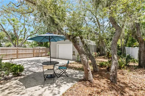a view of a backyard with sitting area and furniture