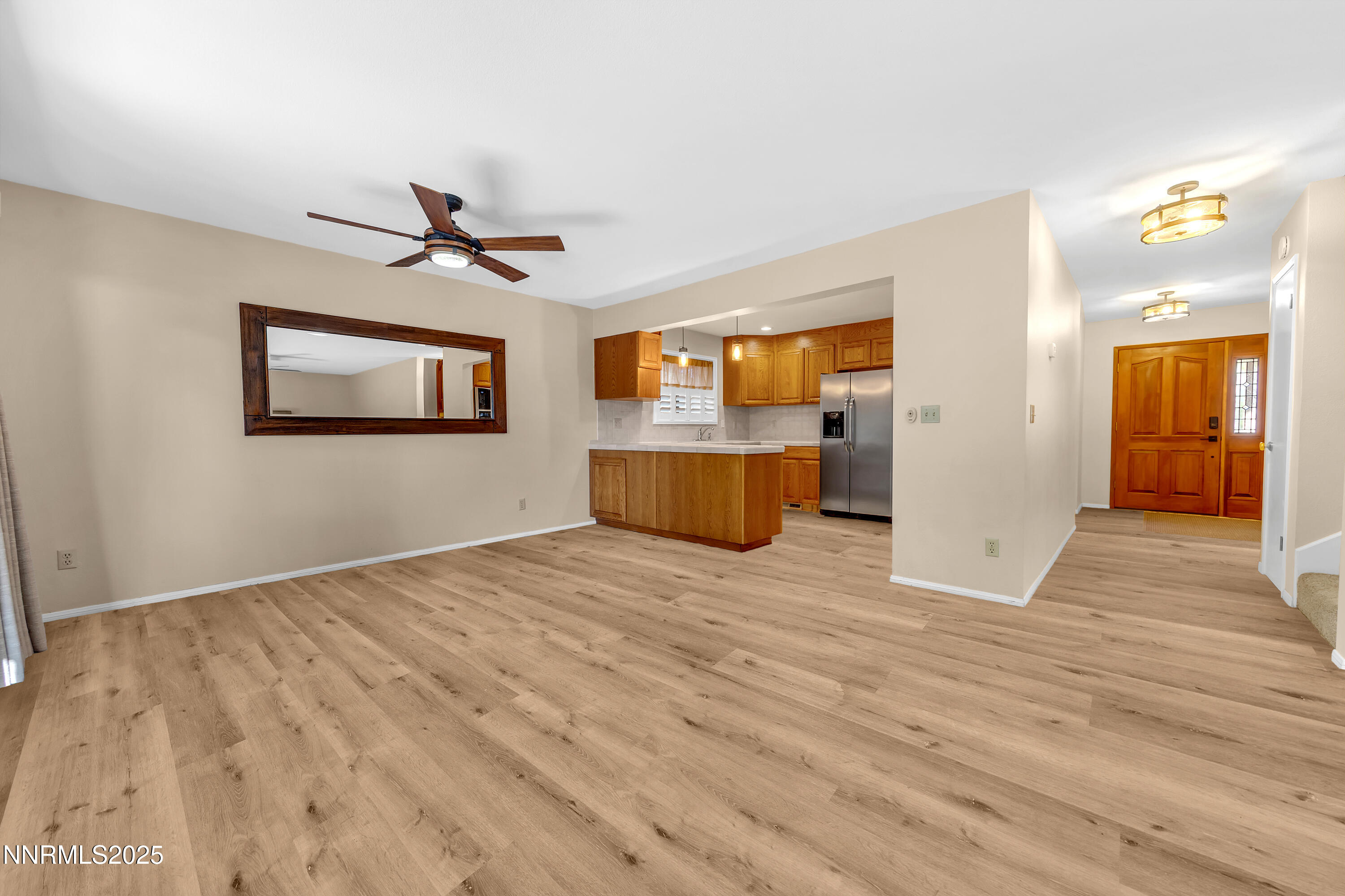 560 Putnam Drive Reno, NV 89503 - Photo 5 of 43 a view of empty room with wooden floor and window