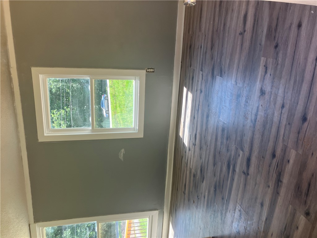 1401 Lebanon Road Pendleton, SC 29670 - Photo 3 of 8 Natural light filters into a room featuring newly installed wood plank flooring.