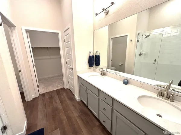 a bathroom with a double vanity sink a and mirror