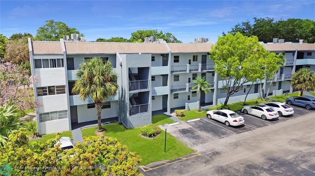 front view of a house with a garden