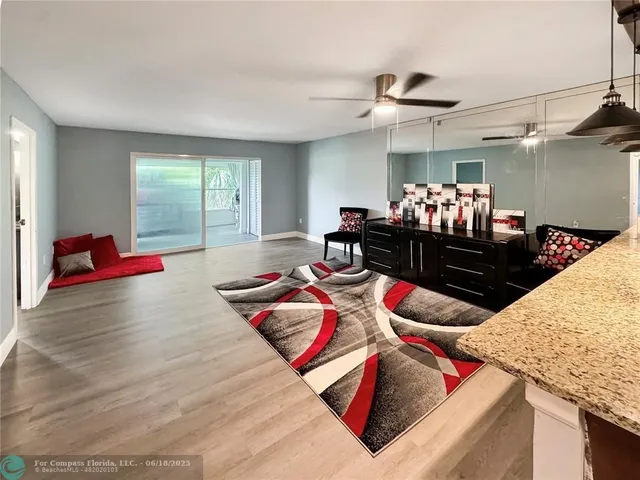 a living room filled with furniture and a rug