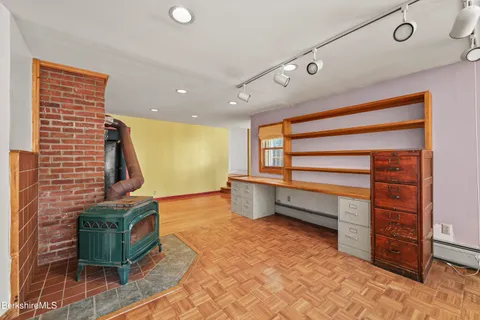 a view of an empty room with a fireplace