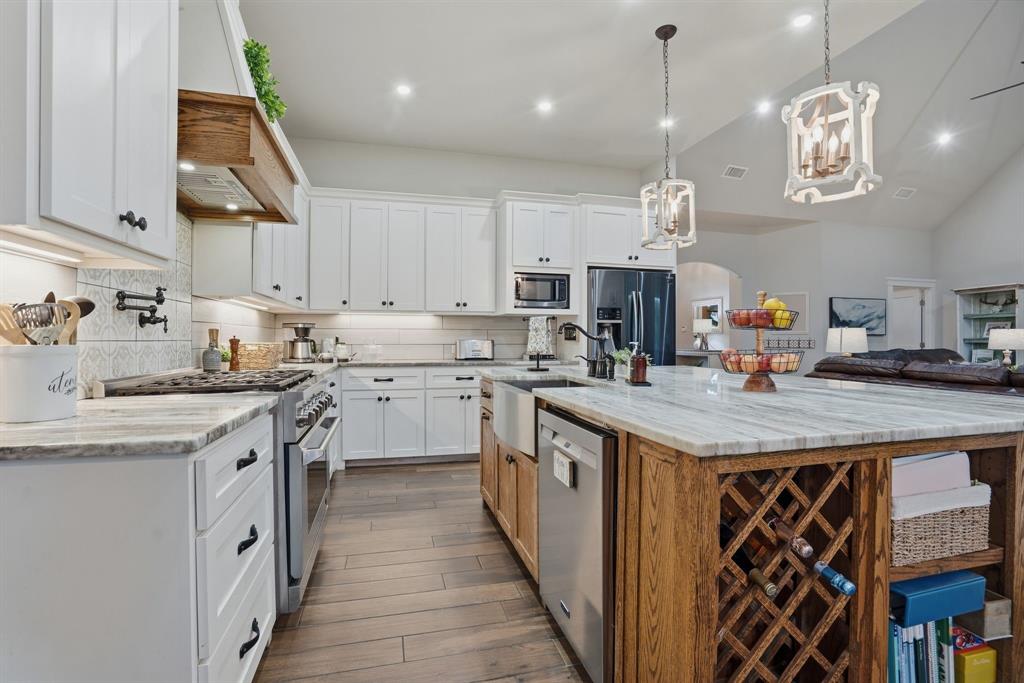 10210 Finch Road Sanger, TX 76266 - Photo 2 of 39 Chef's dream kitchen with large island, gas cooktop and tons of cabinets.