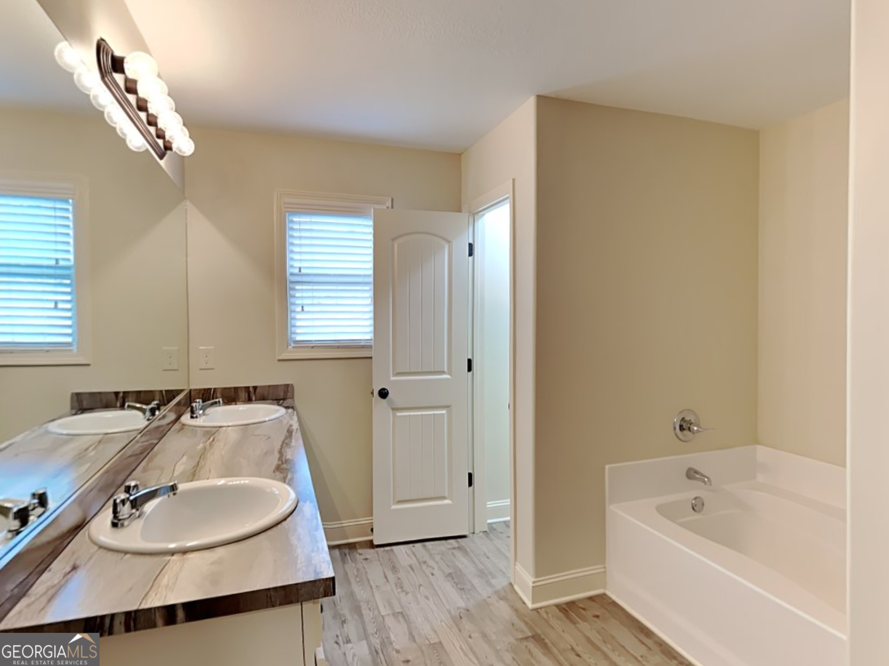 578 River Mist Circle Jefferson, GA 30549 - Photo 18 of 23 a bathroom with a sink and a bathtub