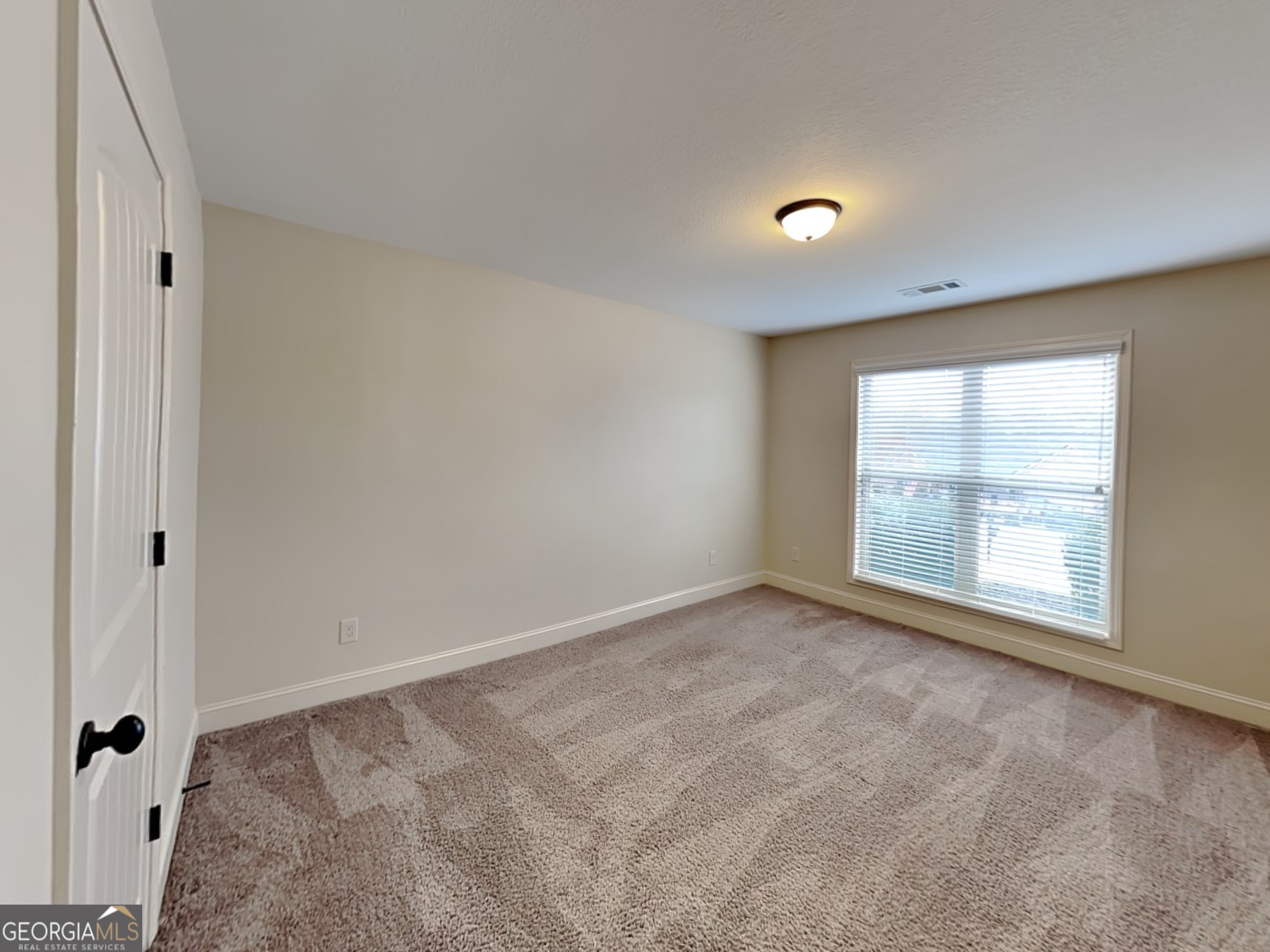 578 River Mist Circle Jefferson, GA 30549 - Photo 9 of 23 a view of an empty room with a window