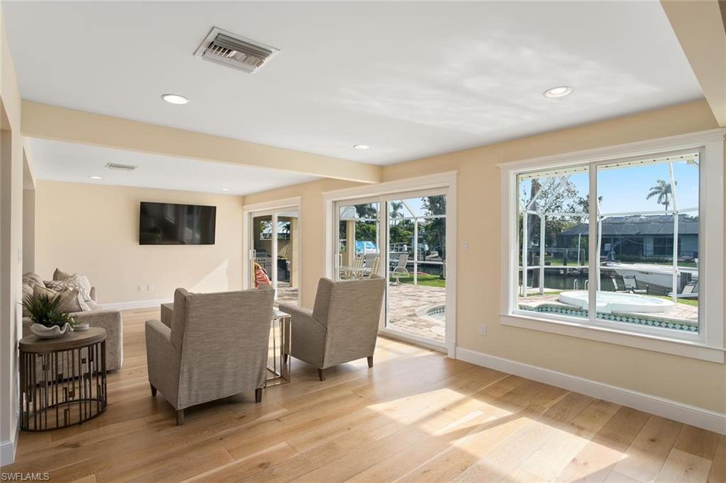 2155 Tarpon Road Naples, FL 34102 - Photo 12 of 24 a living room with furniture and a flat screen tv