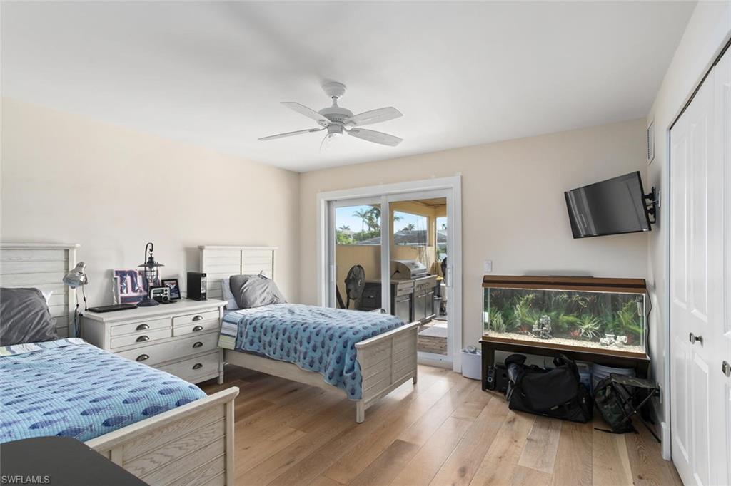 2155 Tarpon Road Naples, FL 34102 - Photo 15 of 24 a living room with furniture and a flat screen tv