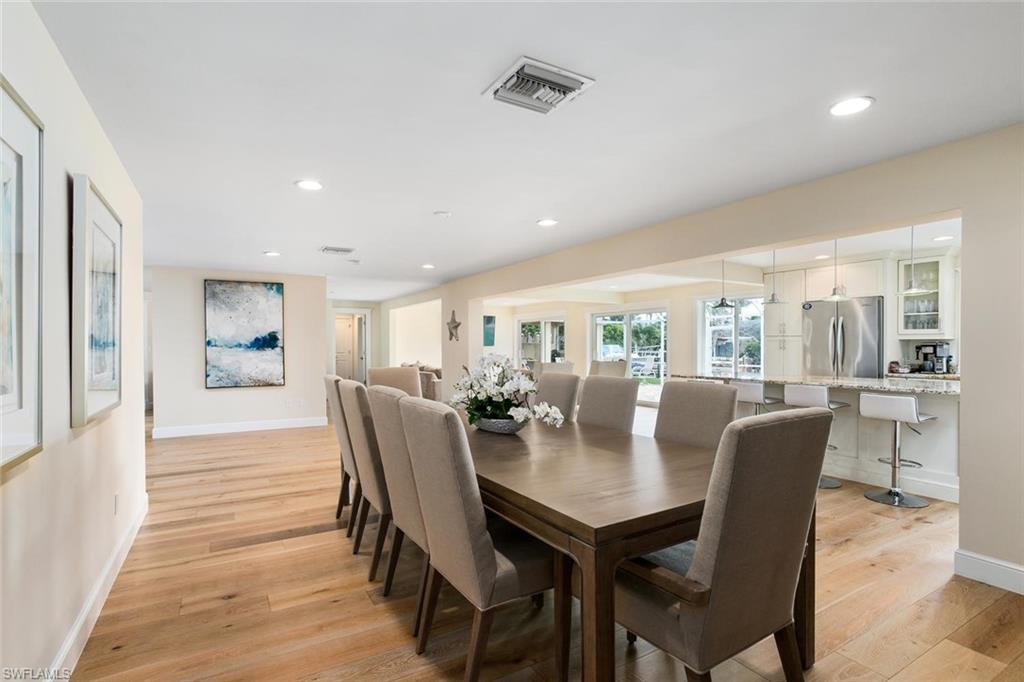 2155 Tarpon Road Naples, FL 34102 - Photo 17 of 24 a view of a dining room with furniture and wooden floor